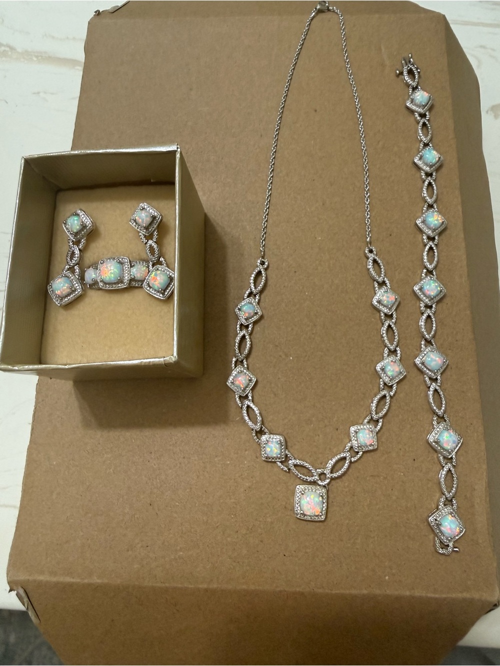 Opal necklace, bracelet, earrings and ring set.